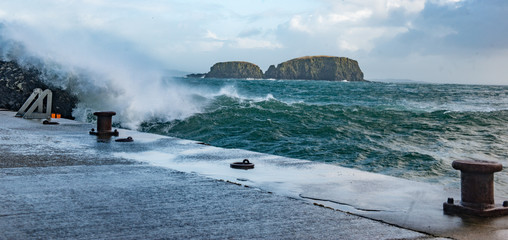Waves crash onto Ballintoy Harbour, Causeway Coast, Northern Ireland