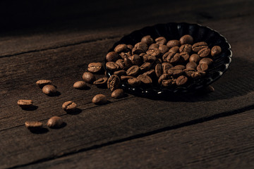 coffee fried beans, on an old wooden background
