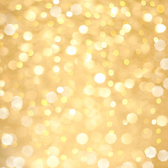 Abstract golden bokeh background, glowing Christmas holiday lights texture
