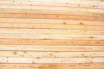Fototapeta premium Background of light pine planed boards with knots and beautiful wood structure, texture design.