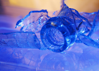 broken glass bottle in blue light