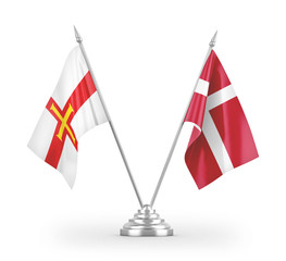 Denmark and Guernsey table flags isolated on white 3D rendering