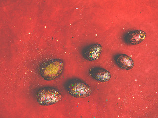 Red gold coloured easter eggs, blurred