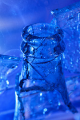  broken glass bottle in blue light