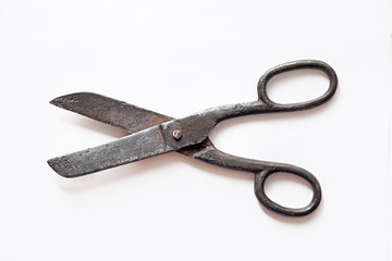 vintage black handmade forged scissors, grandmother's tailor's tools isolated on white background