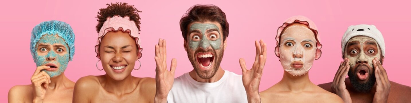 Horizontal Shot Of Emotional People Apply Facial Masks, Care About Complexion, Hygiene, Enjoy Pampering And Cosmetic Treatments, Express Surprise And Happiness, Stand In Row Over Pink Stuido Wall