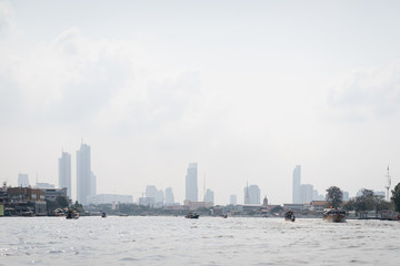 Boat for travel in Chao Phraya river in Bangkok, Thailand in a summer day