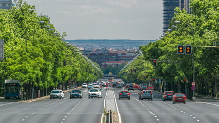 Paseo de la Castellana street traffic timelapse near Puerta De Europa towers as viewed from Plaza...