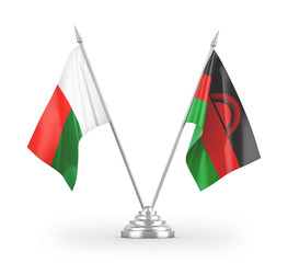 Malawi and Madagascar table flags isolated on white 3D rendering