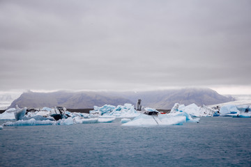 Icebergs in Jokulsarlon lagoon beneath Breidamerkurjokull glacier Sudhurland, Iceland. Place for...