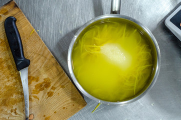 Preparation of sweet lemon wooden chopping board with knife.