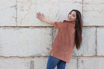 Portrait of model, woman posing with ideal slim sexy body, wearing longsleave shirt and jeans in...