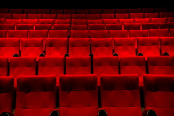 Red color  Cinema seats with no people.