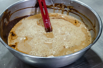 hazelnut praline in a pot with white chocolate