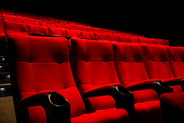 Red color  Cinema seats with no people.