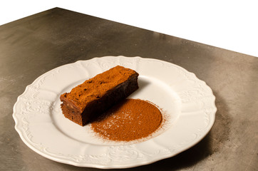 chocolate pie in white plate close up