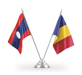 Romania and Laos table flags isolated on white 3D rendering.