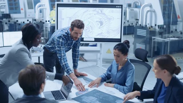Modern Factory Office Meeting Room: Busy Diverse Team of Engineers, Managers and Investors Talking at Conference Table, Use Interactive TV, Analyze, Find Solutions, Debate and Discuss Engine Concept