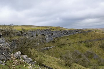 Fototapeta na wymiar Winter view of Malham Cove, from a pastureland approach, in February, 2020