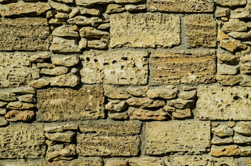 Stone wall. The wall is made of stone. The wall is made of bricks. The structure of the stone.