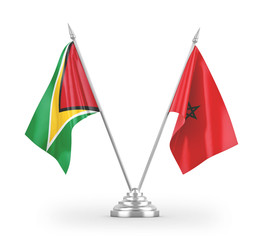 Morocco and Guyana table flags isolated on white 3D rendering