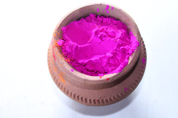 Traditional color celebration, Bright colors in clay pot for Indian Holi Festival, Organic Gulal colors pattern.