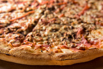 Freshly baked pizza on the cardboard