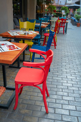 Fototapeta na wymiar Tbilisi, Georgia, 21 December 2019 - outdoor cafe terrace with colorful chairs