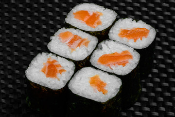 Japanese rolls on a dark textured background