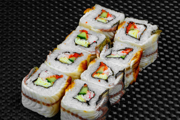 Japanese rolls on the dark textured background