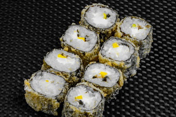 Japanese rolls on the dark textured background