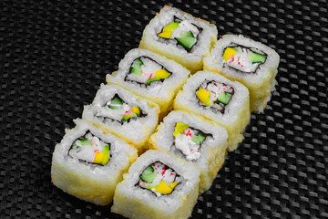 Japanese rolls on the dark textured background