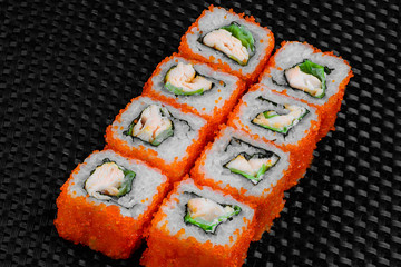 Japanese rolls on the dark textured background