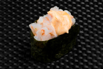 Japanese sushi on the dark textured background