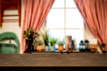 Desk of brown color and window background 