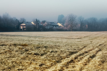 Fototapeta premium Fog morning field forest frost house