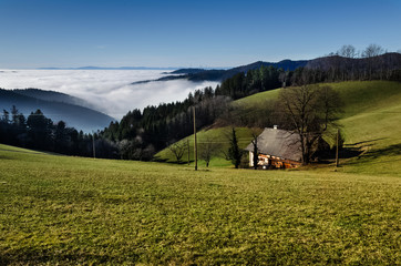 House on the slope of the mountain rays of the sun