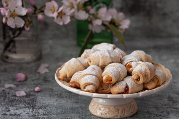 Shortbread rolled cookies filled with apricot jam