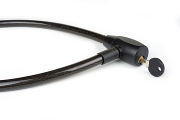Bicycle lock with a key on a white background. Safety concept