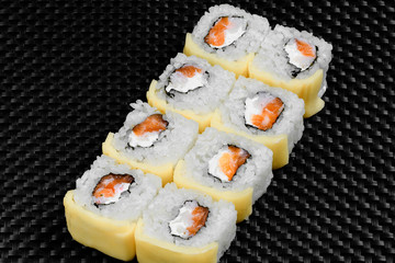 Japanese rolls on a dark textured background