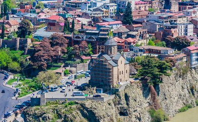 Obraz premium The Metekhi temple, which is picturesquely located on a rock above the Kura river. One of the business cards of Tbilisi.Georgia