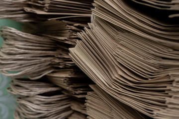 Side View Of Huge Stack of Recycled Paper close up. Business concept. Huge Stack of Recycled Paper envelopes closeup.