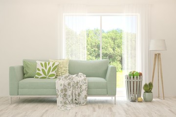 Minimalist living room in white color with sofa and summer landscape in window. Scandinavian interior design. 3D illustration