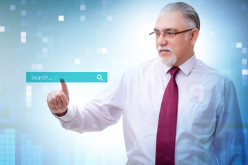Search concept with businessman pressing button