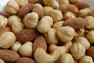 Fresh dried nuts, almonds and cashews, close-up, crispy nuts,