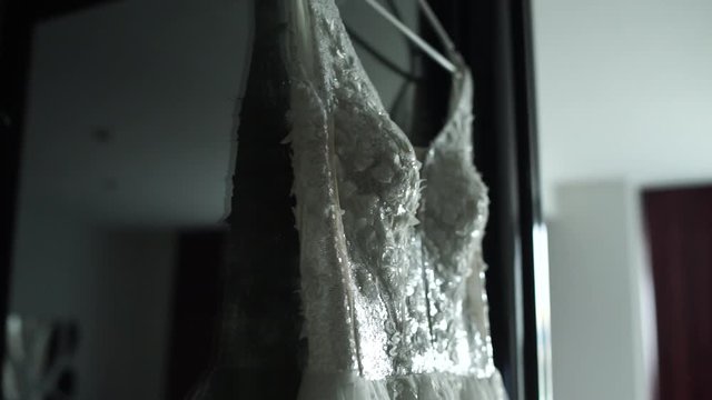 wedding dress hanging on the wall