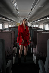  WOMAN WITH RED DRESS INSIDE THE TRAIN