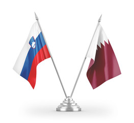 Qatar and Slovenia table flags isolated on white 3D rendering