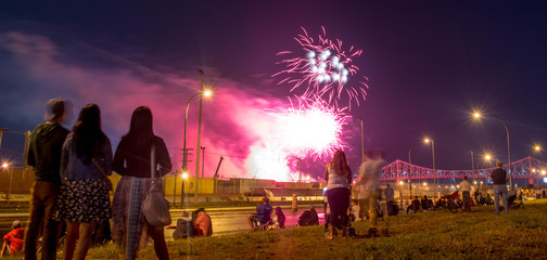 people watching fireworks. Jacques Cartier bridge with fireworks. Montreal Fireworks.