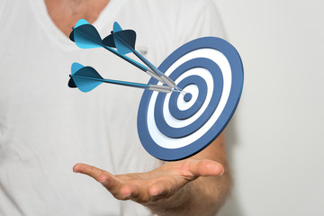 arrow hitting in the target center of dartboard on bullseye.
